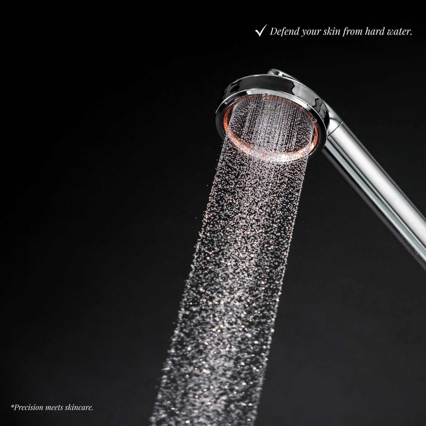 Close-up of high-pressure water stream from SOAH shower head on black background, illustrating advanced filtration and protection against hard water damage to skin.