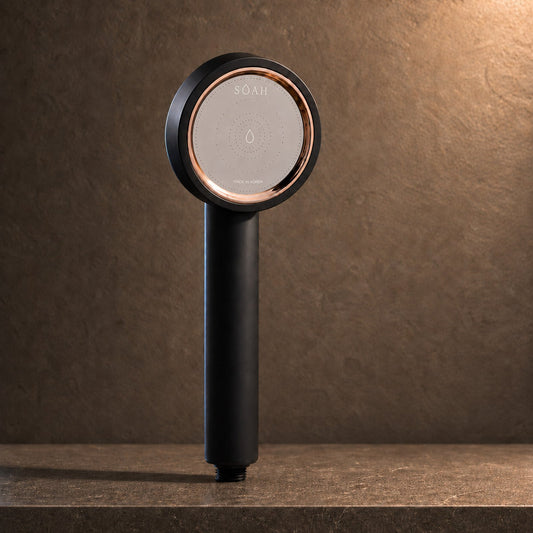 SOAH Black Edition vitamin C shower head displayed on a stone background for a premium shower experience in the UAE.