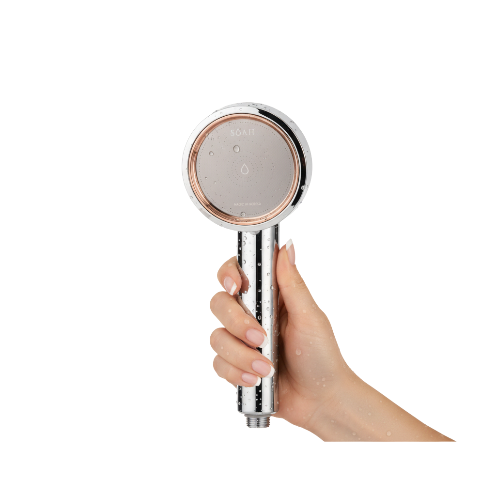 SOAH Vitamin C shower head held in hand, luxury Korean filter for skincare and hard water protection in UAE
