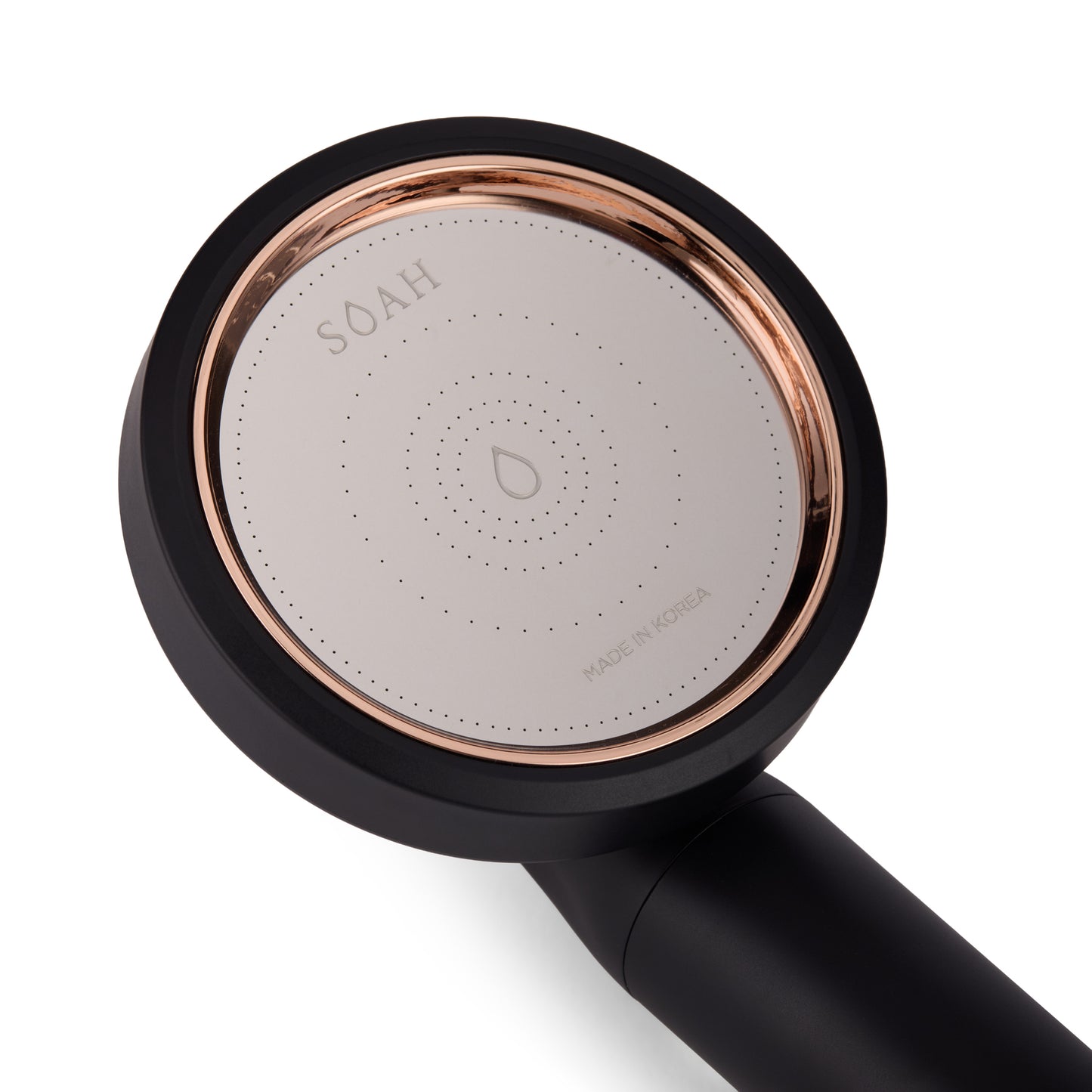 Close-up of SOAH Black Edition Vitamin C shower filter with rose gold trim