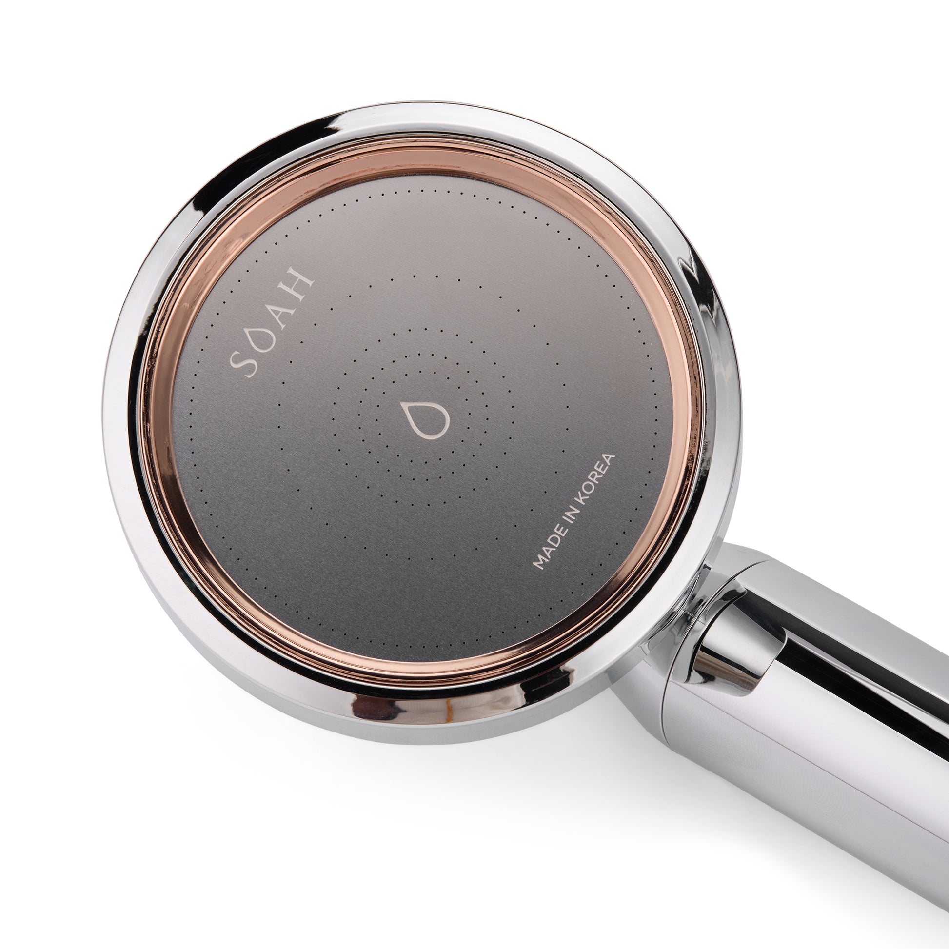 Close-up of SOAH Chrome Edition Vitamin C shower filter with rose gold and silver finish